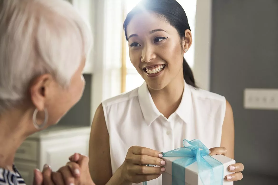 Woman presenting a gift Woman presenting a gift